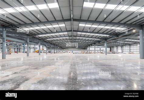 The interior of a modern industrial warehouse unit Stock Photo - Alamy