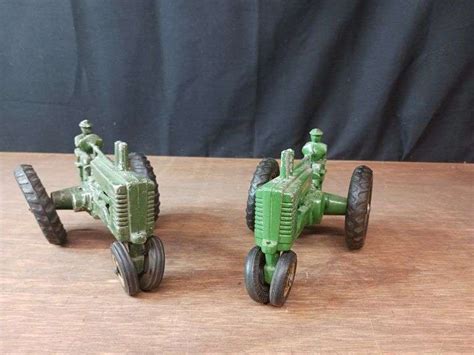 (2) 1/16 John Deere A Tractors Ertl - Aumann Auctions, Inc.