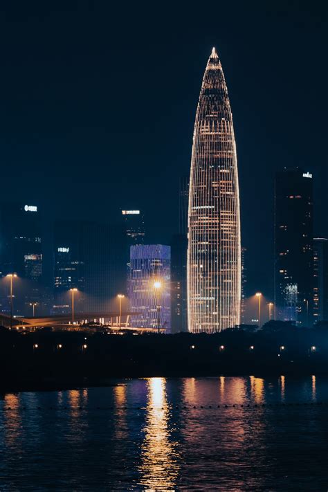 A city skyline at night photo – Free Shenzhen Image on Unsplash