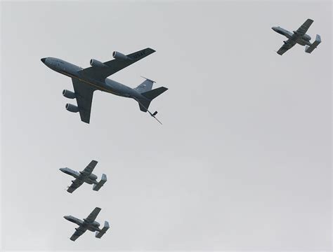 Boeing KC-135 Stratotanker refueling jet with A-10 Warthogs in f ...