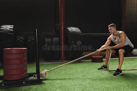 Sled Drag Exercise. Sportsman during His Cross Training Workout. Stock ...