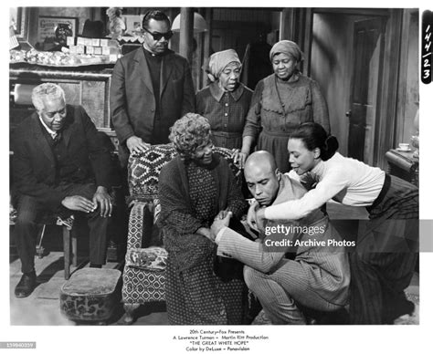 James Earl Jones is hugged by Marlene Warfield before family members ...