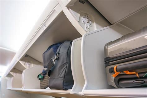 Carry-on luggage storage compartment on an airplane 1996324 Stock Photo ...