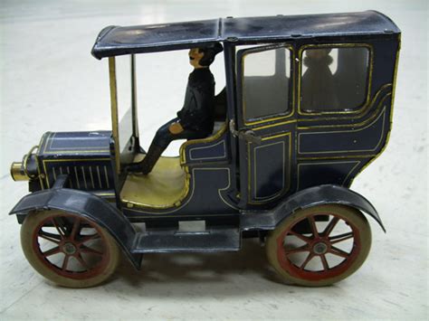 Circa 1909 Open Drive Limousine Toy with Figures | DFW Elite Toy Museum