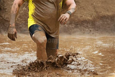 Mud race runners stock photo. Image of dirt, legs, water - 96419706