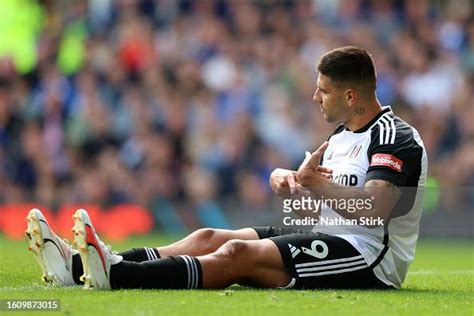 Aleksandar Mitrovic of Fulham goes down with an injury but plays on ...