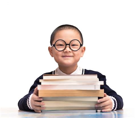 Smiling student sitting with his books Photo | Free Download