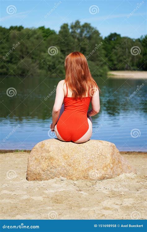 Rear View of Young Woman Wearing Red Swimsuit or Bathing Suit Sitting ...