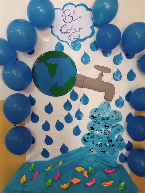 a blue earth themed birthday party with balloons and streamers on the ...