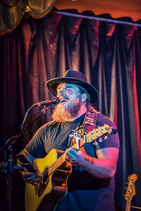 Man Playing Guitar While Singing · Free Stock Photo