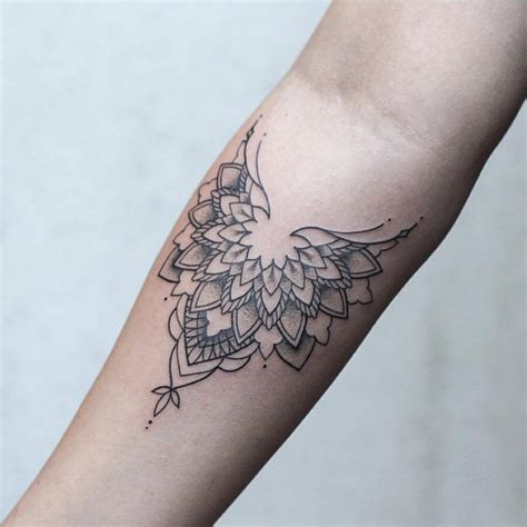 Half mandala tattoo on the forearm by Rach Ainsworth - Tattoogrid.net