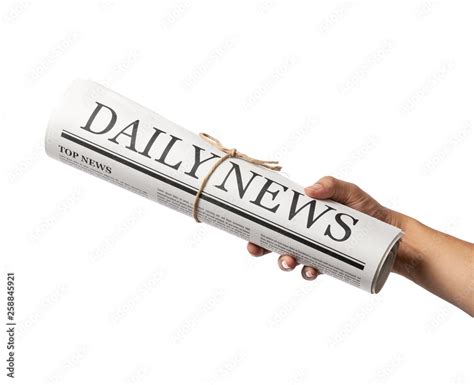 Hand holding Rolled Business Newspaper with the headline News isolated ...