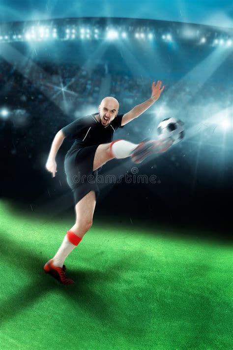 Man Playing Soccer and Shooting a Ball in the Game Stock Photo - Image ...