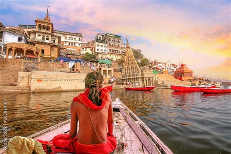 Varanasi city architecture with Ganges river bank at sunset with view ...