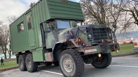 Military Truck With Extending Sides Becomes Camper With Solar Roof