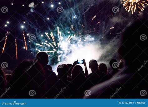 New Year Concept - Cheering Crowd and Fireworks Stock Image - Image of ...