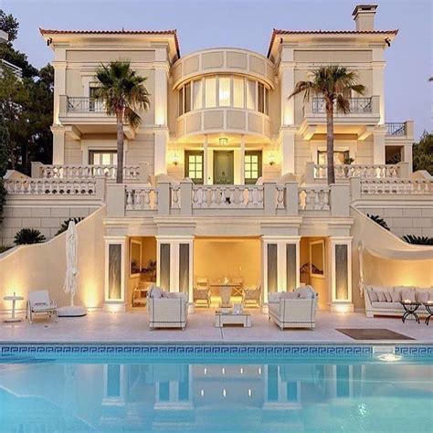 a large house with a swimming pool in front of it