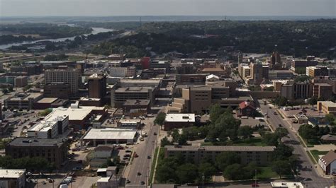 5.7K stock footage aerial video flying by 5th Street between office ...