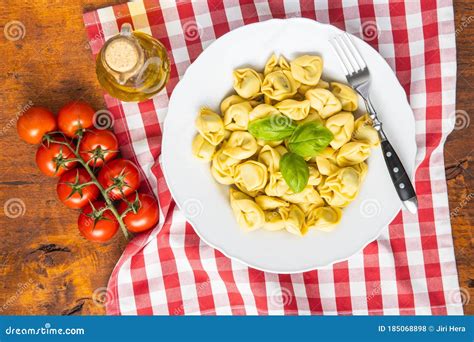 Tortellini Pasta. Italian Stuffed Pasta with Basil Leaves Stock Photo ...