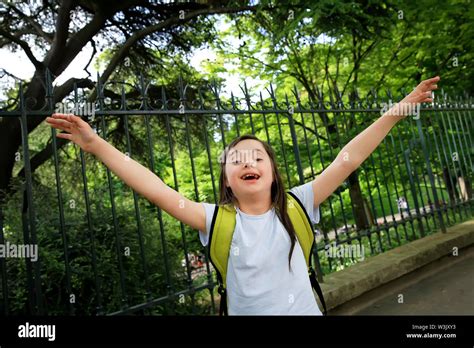 Portrait of little girl smiling outside Stock Photo - Alamy