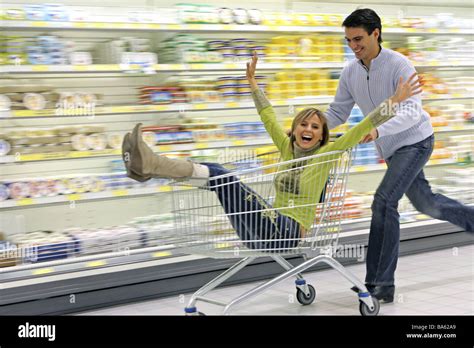 Supermarket pair omitted shopping carts people shopping customers ...