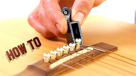 How to Remove Guitar Strings - Acoustic Guitar Maintenance - YouTube