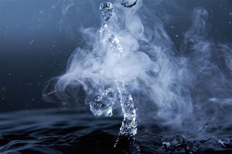 Boiling Water Splash with Steam on Dark Blue Background Closeup Stock ...