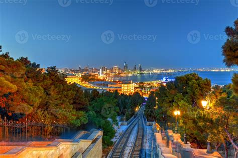 Baku Funicular with a view of the city skyline at night in Azerbaijan ...