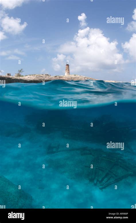 Under over divers on paddlewheelt shipwreck Elbow Cay lighthouse Cay ...