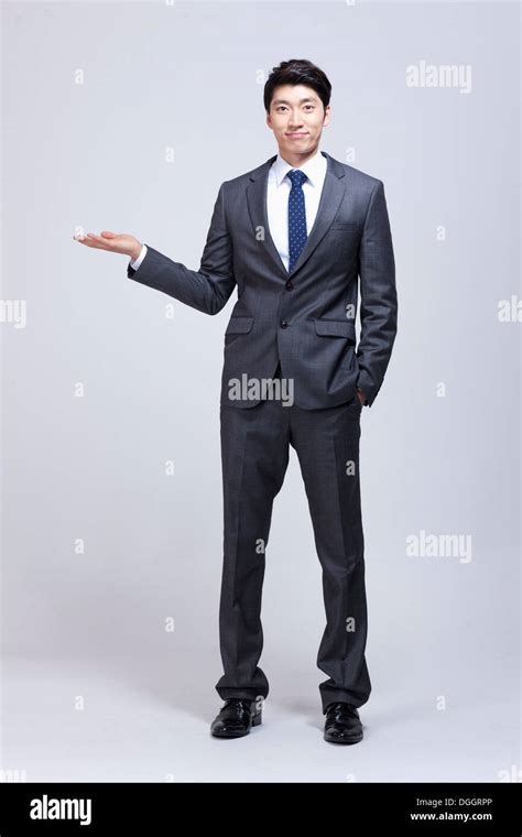 a business man holding his hand out Stock Photo - Alamy