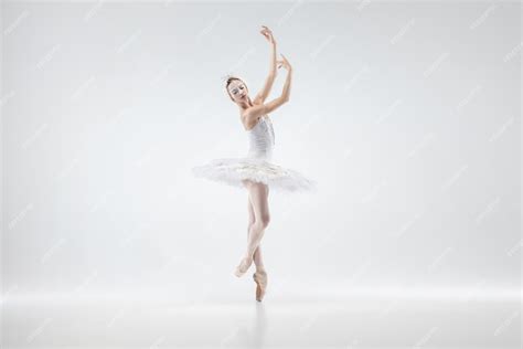 Free Photo | Young graceful ballerina on white studio background