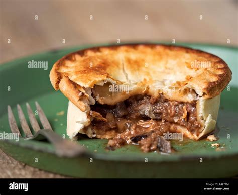 rustic meat and mushroom pie Stock Photo - Alamy