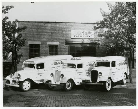 Three White Castle delivery trucks are pictured in front of a White ...