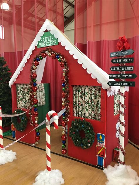 a christmas themed house with candy canes on the floor