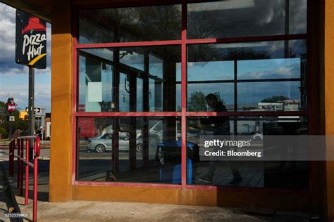 A customer inside a Pizza Hut restaurant in the Queens borough of New ...