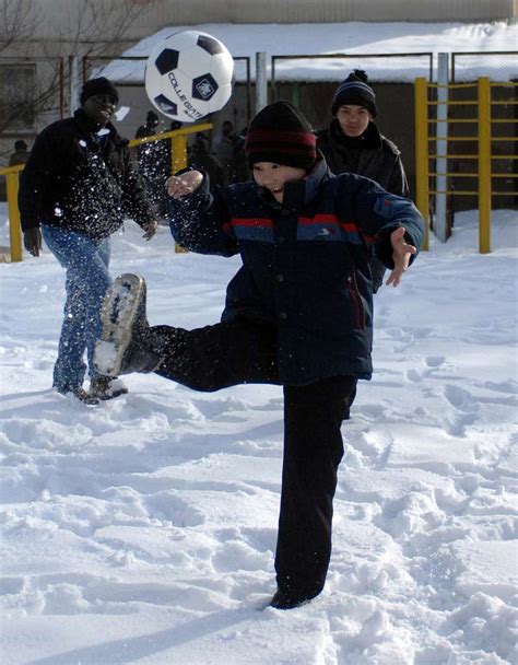 A young boy shows off his soccer skills to Staff Sgt. - NARA & DVIDS ...