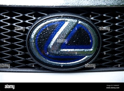 Silver blue Lexus (car brand) logo covered with rain Stock Photo - Alamy