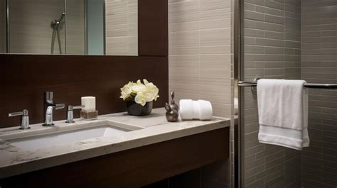 Premium AI Image | A hotel bathroom featuring white tiled walls