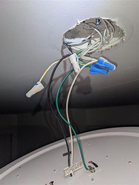 Trying to install a simple ceiling light. Connected the wires as shown ...