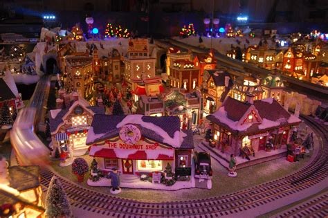 Our Yearly Christmas Village. Lionel train, trolley, 150 houses make up ...