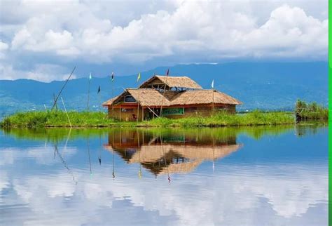 A house on the Loktak Lake, Manipur, the largest saltwater lake in Asia ...