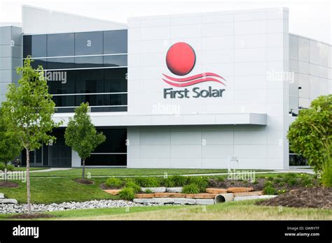 A logo sign outside of a facility occupied by First Solar in Perrysburg ...