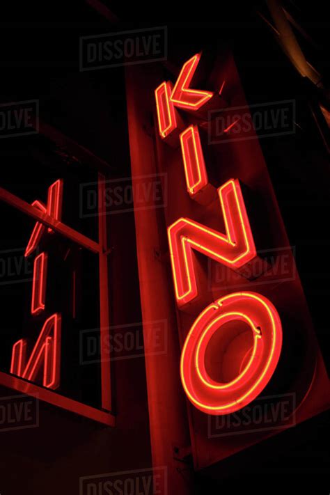 Neon red movie theater sign, Berlin, Germany - Stock Photo - Dissolve