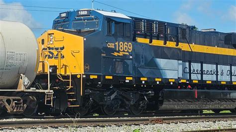 CSX 1869 Chesapeake & Ohio heritage unit as mid train DPU on M692-16 ...