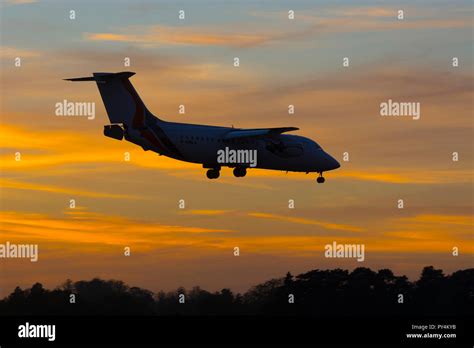 Jota Aviation Bae 146 landing at sunset, Birmingham Airport, UK Stock ...