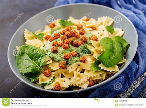 Vegan Farfalle Pasta with Spinach Sauce with Fried Chickpeas. Stock ...