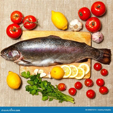 Fresh Raw Fish and Food Ingredients on Table Stock Photo - Image of ...