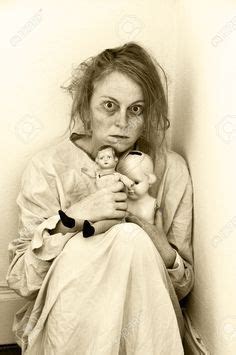 Woman In A Psychiatric Ward With Two Dolls. Stock Photo, Picture ...