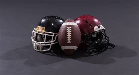 american football and helmets isolated on gray 12719664 Stock Photo at ...