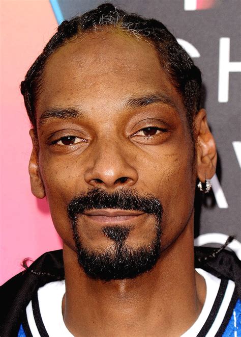 Snoop Dogg’s 6 Tattoos & Their Meanings - Body Art Guru